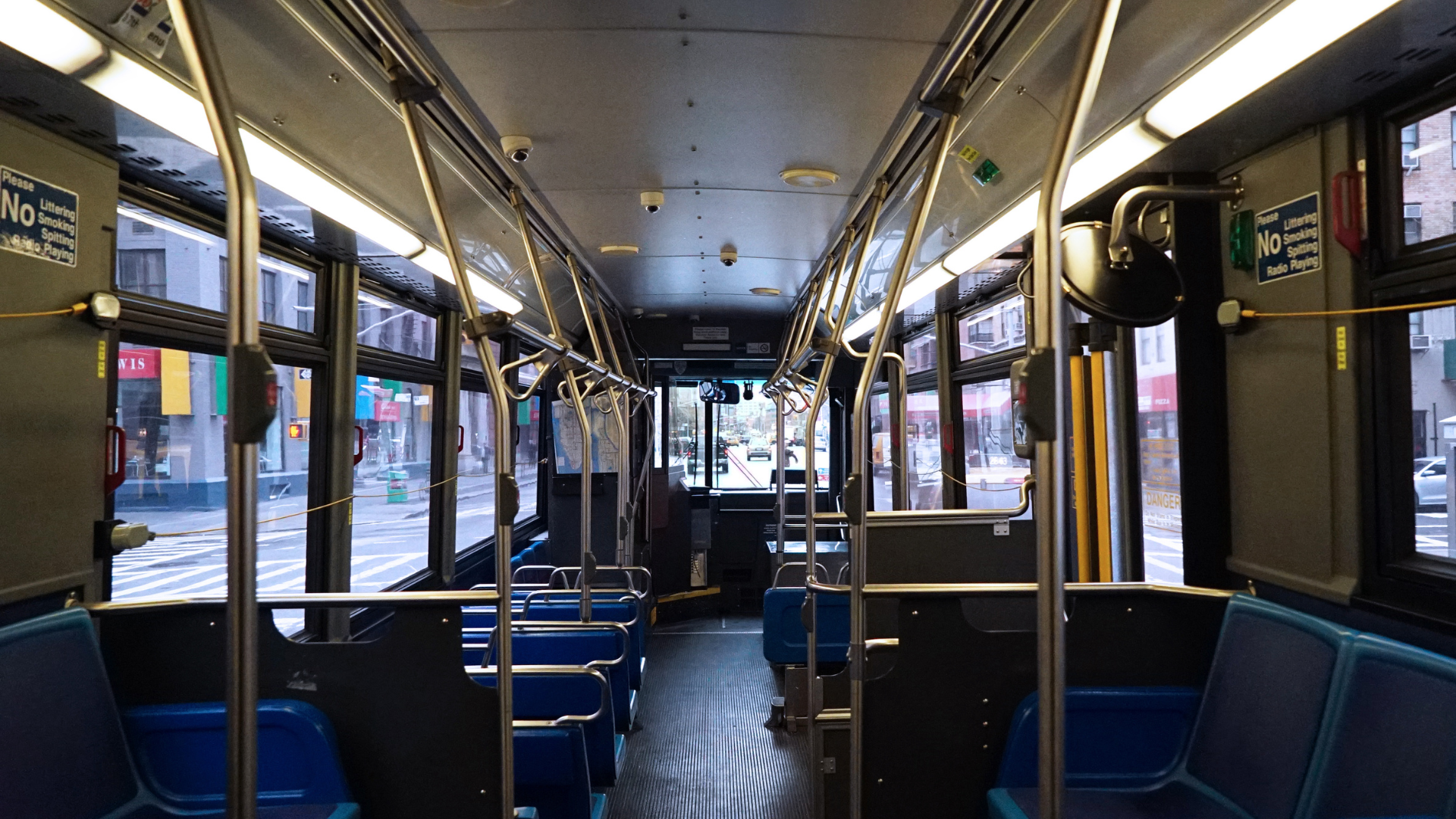 Interior of an empty New York City bus.